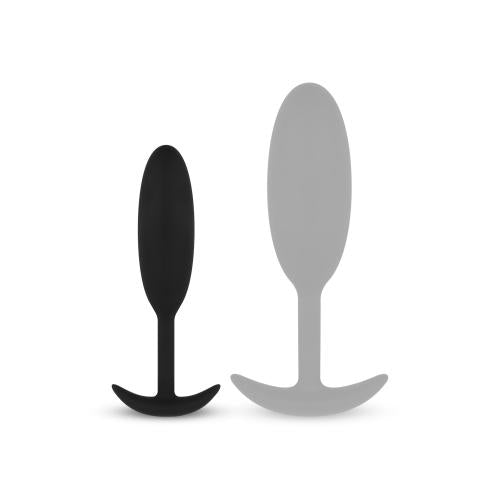 Zwarte en grijze silicone buttplugs, ontworpen voor comfortabele en plezierige ervaringen met extra gewicht.