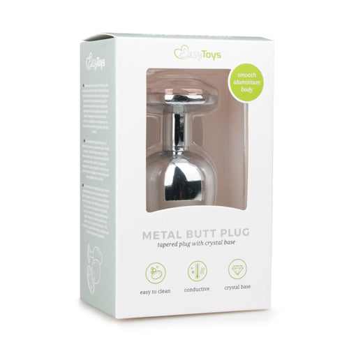 Zilverkleurige metalen buttplug met transparante kristalbasis in verpakking, ideaal voor seks artikelen.